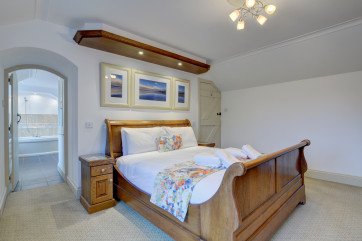 The master bedroom with a sleigh style bed