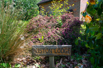 Property nameplate in garden