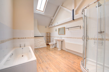 The bathroom is very generously apportioned with both a bath and separate corner powerful shower