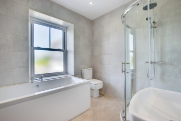 Master bathroom with bath and separate shower unit