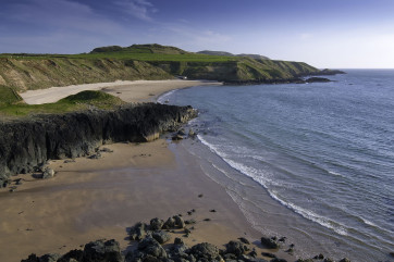The sand at Porth Oer (5.5 miles) sometimes 'squeaks' under your feet