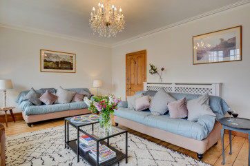 First floor sitting room with comfortable sofas