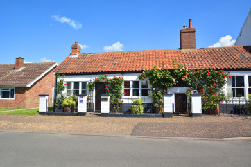 This skilfully converted former coach house has many character features such as beamed ceilings, wall timbers and an inglenook fireplace
