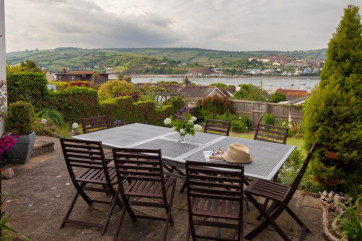 Large table & chairs on the terrace, in a sheltered terrace spot with gorgeous views.