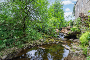 Waterfall at the side of the cottage