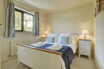 Cosy, double bed with bedside tables 