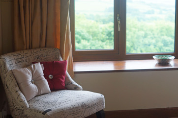 Chair to enjoy the far reaching views from the master bedroom