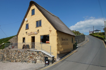 Thatched roof bakery and upstairs tea room in Aberdaron