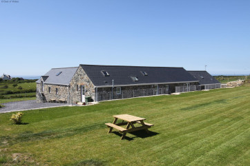 Spacious communal garden with countryside and sea views.