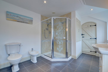 The large en suite bathroom which has a separate shower and bath
