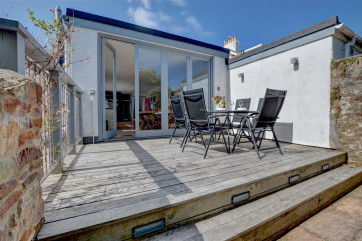 Decked patio area with garden furniture so you can enjoy al fresco dining 