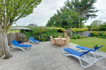 Large patio area with garden furniture 