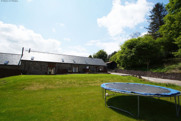 Large rear garden with a trampoline