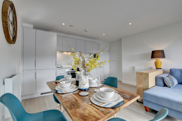 The well equipped kitchen area with granite worktops adds to the style, together with a dining table