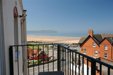 A stylishly furnished apartment with private parking in a great location with a short walk to this blue flag beach