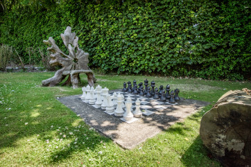 Each cottage has its own private area with table, chairs and a gas barbecue, perfect for al fresco dining. There is also shared use of the extensive gardens with a summerhouse, outdoor chess set and swing ball 
