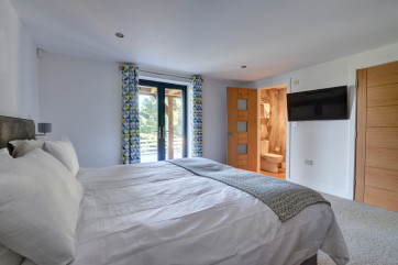 The fifth bedroom also has patio doors and an ensuite bathroom