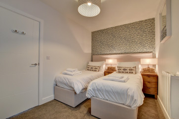 The comfortable twin bedroom which it situated on the first floor