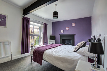 Master bedroom with beamed ceiling