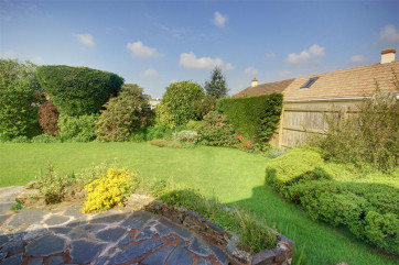 Pretty bordered garden in peaceful surroundings