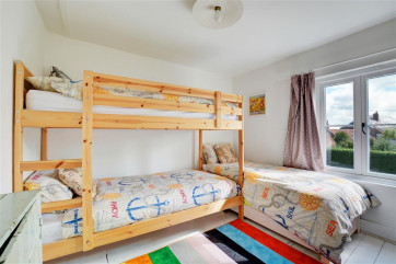 Bedroom three has bunk beds and a single bed, making it perfect for children
