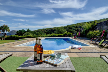 Enjoy a cool beer and a dip in the pool after a day at the beach