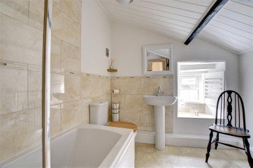 Lovely modern bathroom suite is perfect for a relaxing soak.