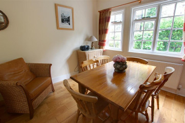 Step down into this lovely dining room with views out to the lane