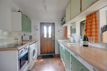Kitchen is modern and well equipped.