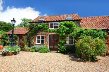A lovely clematis clad brick and flint cottage in lovely countryside and close to the coast.