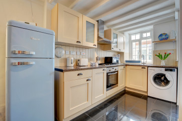 The compact kitchen is well equipped