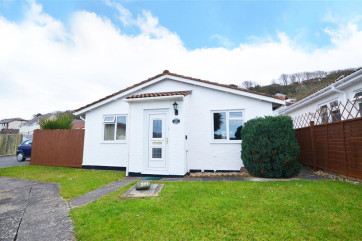Summer Breeze is a delightful detached bungalow with lovely distant sea views