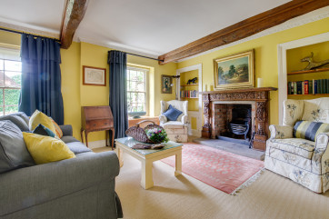 Colourful Sitting room with comfortable seating and character features