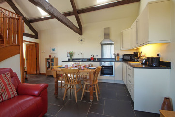 Lounge area with inviting leather sofas, flat screen TV & Nintendo Wii