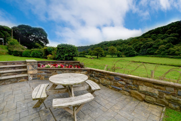 Fantastic views overlooking the river Gwaun from the garden, with picnic table and chairs