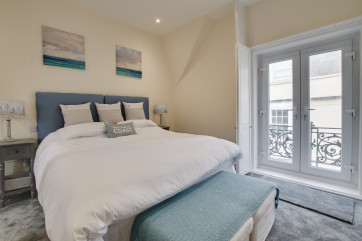 Master bedroom with Juliette balcony and ensuite bathroom