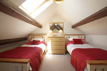 Bedroom 2 - Gallery twin room with sloping eaves.