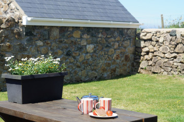 The patio is perfectly located to capture the sea & countryside views