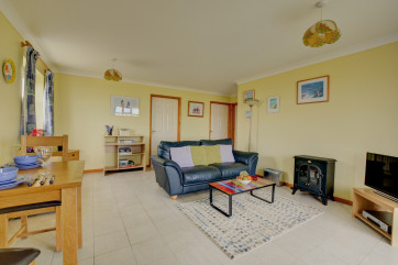 TV, video, woodburner-style electric fire, table and chairs, radio and CD player are all in the sitting room.