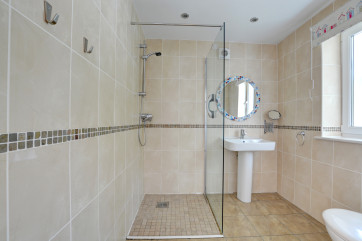 Ground floor shower wet room with toilet & whb.