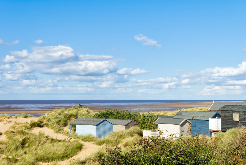 A wonderful place to walk amongst the sand dunes and pastel coloured beach huts