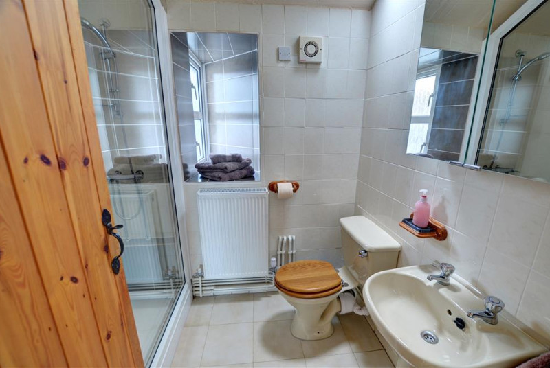 Leading through from the double bedroom is and en suite shower and WC
