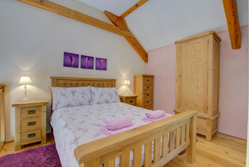 The double bedroom is on the mezzanine floor and has an ensuite shower room, WC and basin
