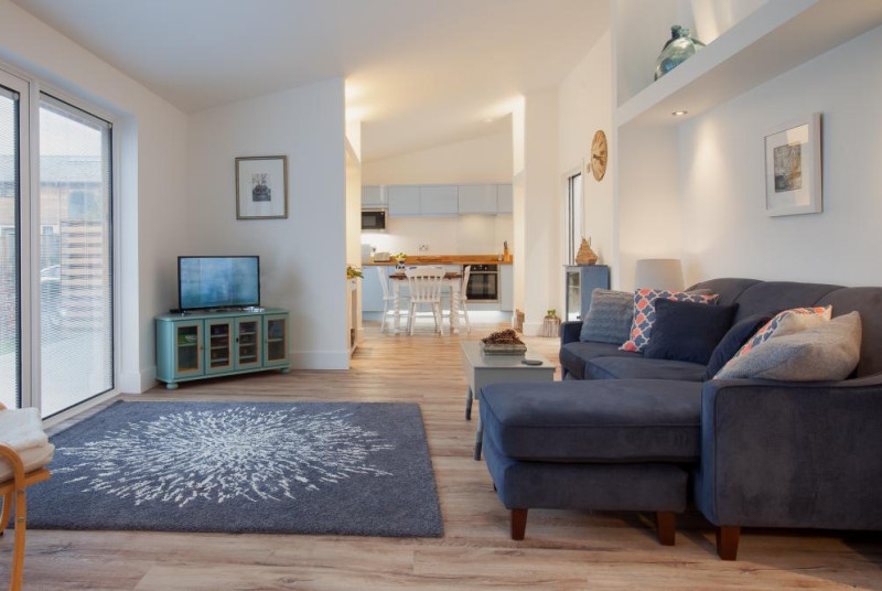Hygge House, Shaldon - Living area with sofa and television