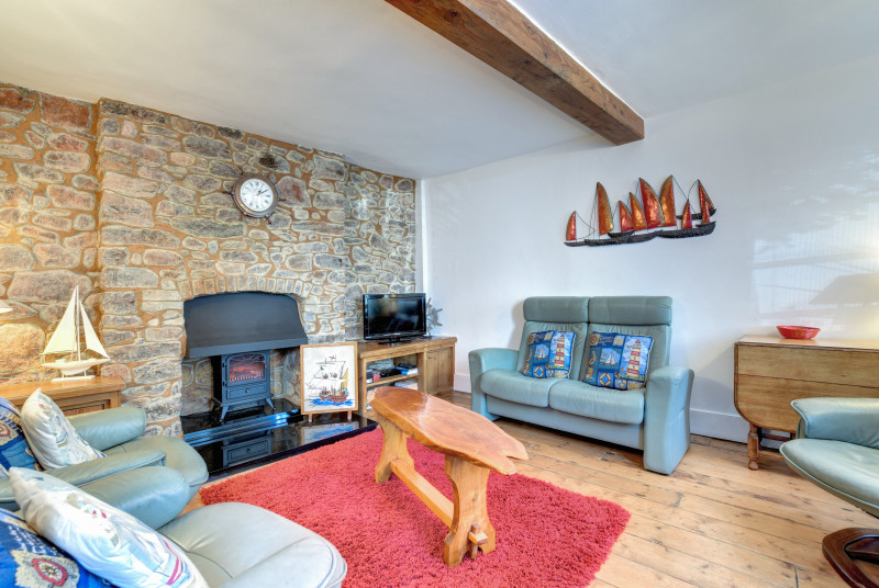 Living/Dining Room: Open plan living accommodation with dining table chairs and bench in one corner and comfortable sofas. Freeview TV, DVD & Blu-ray player. This spacious area has a cosy cottage feel with its exposed walls and nautical theme.