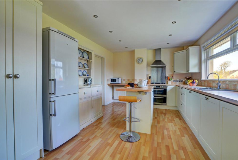 High quality fully fitted kitchen with a picture window and views over the garden