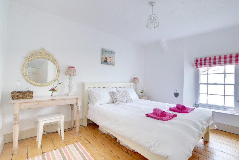 The pretty double bedroom with wooden floors and wonderful views