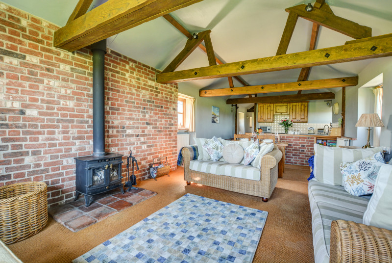 The sitting room has a traditional woodburner for those cosy evenings