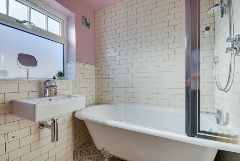 Bathroom with bath, over bath shower, washbasin and wc