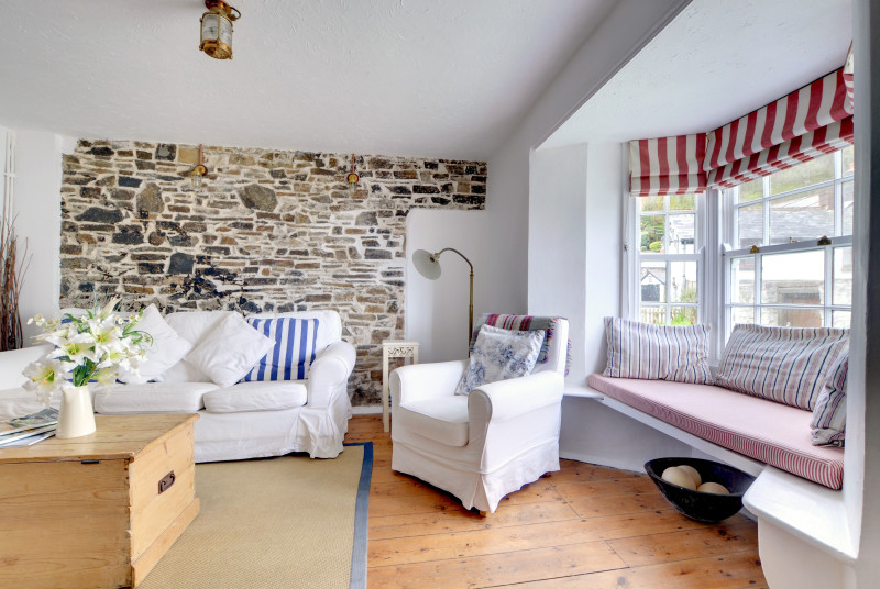 Stone feature wall and alcove seating in the cosy sitting room